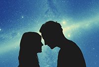 Silhouettes of a couple under the starry sky