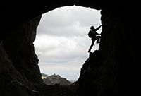 Silhouette of a Person Rock Climbing