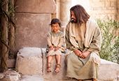 A young jewish boy sits next to the Savior, Jesus Christ.