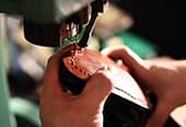 A cobbler repairs shoes