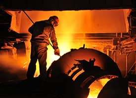 A man works in a steel mill
