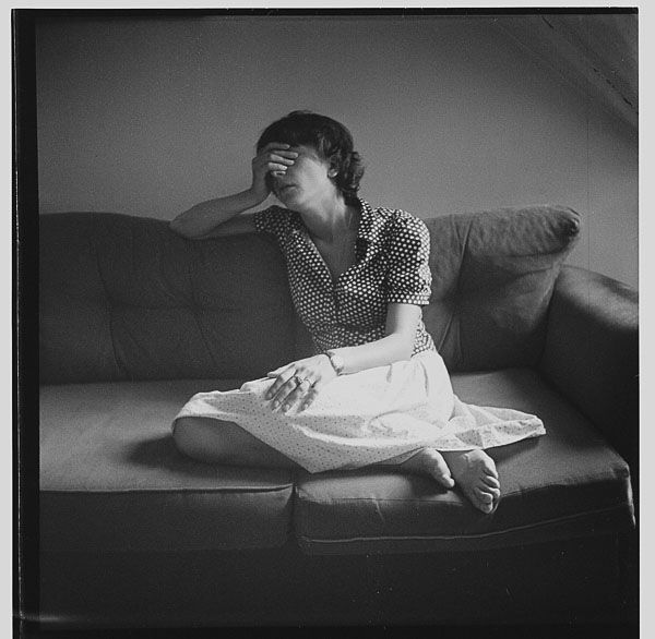 distressed woman on couch