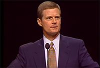 David A. Bednar speaking at the pulpit in the Marriott Center.