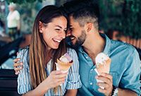 A couple enjoying ice cream cones together