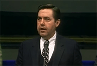 A young Jeffrey R. Holland addresses students at BYU